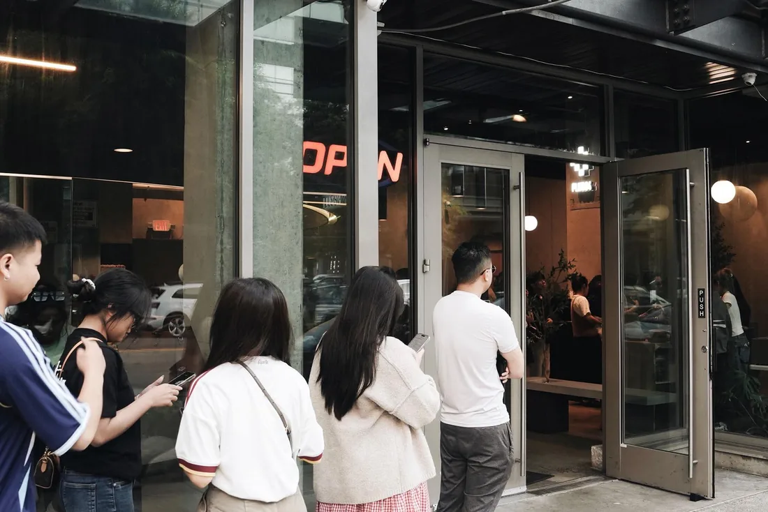 People queuing outside the shopfront
