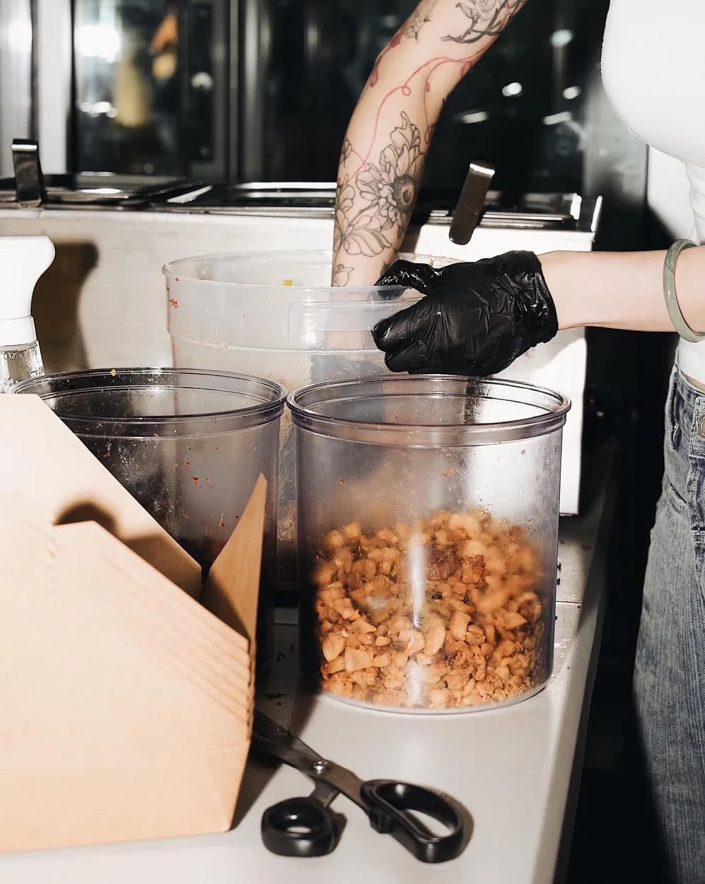 Packing boxes behind the counter at a pop-up